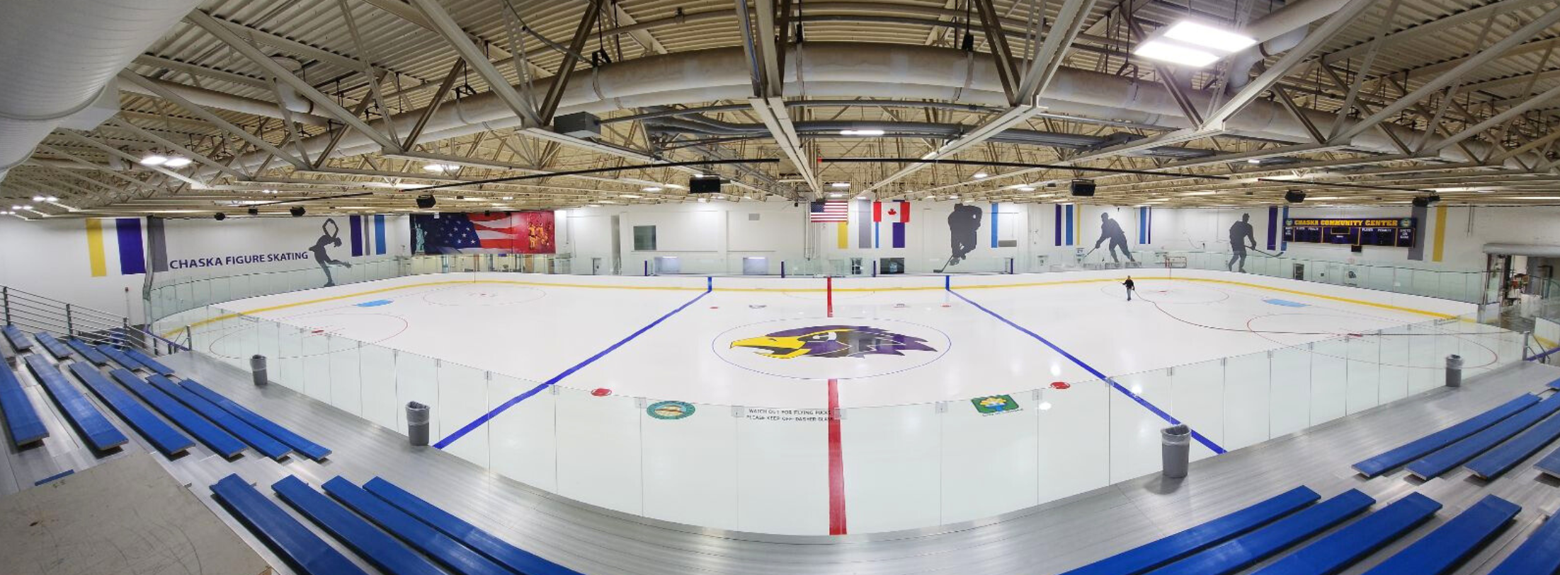 Fish eye view of the Chaska Community Center featuring the bleachers, full sheet of ice, and logos
