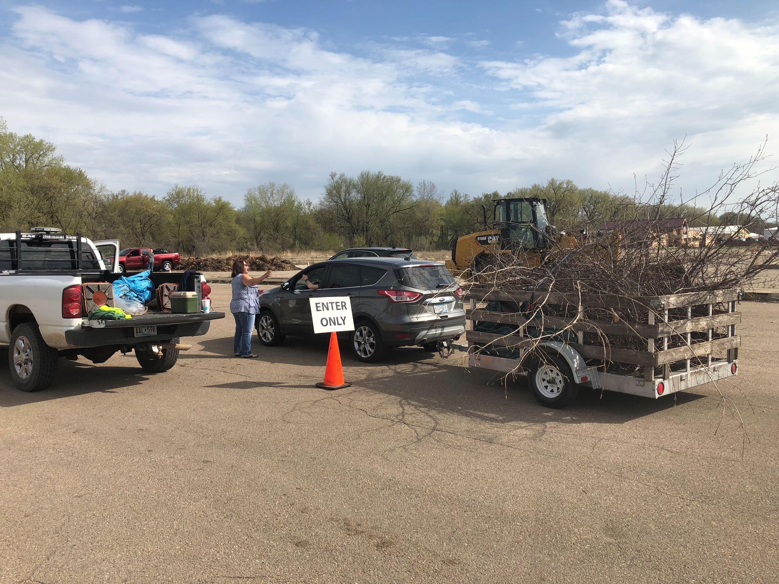 Car with trailer of branches 