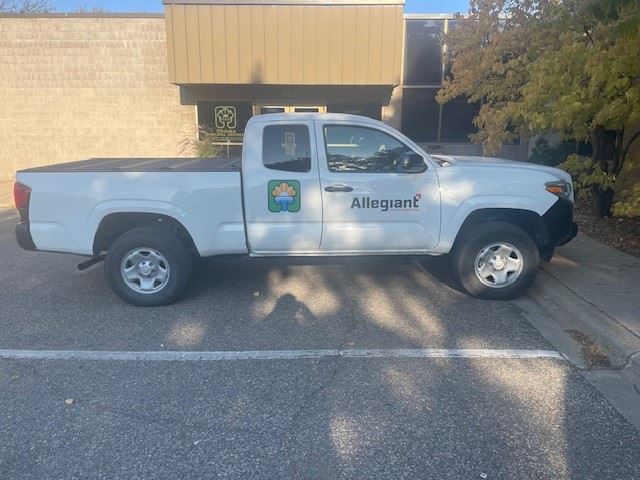 Truck with allegiant and city of Chaska's logos